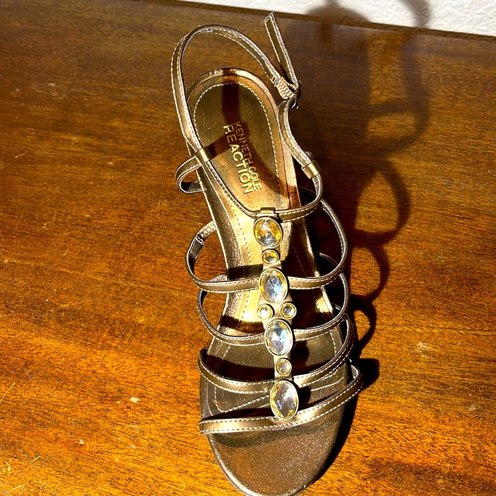 Sandals are very pretty and in great shape except one tiny nick on the heel.
